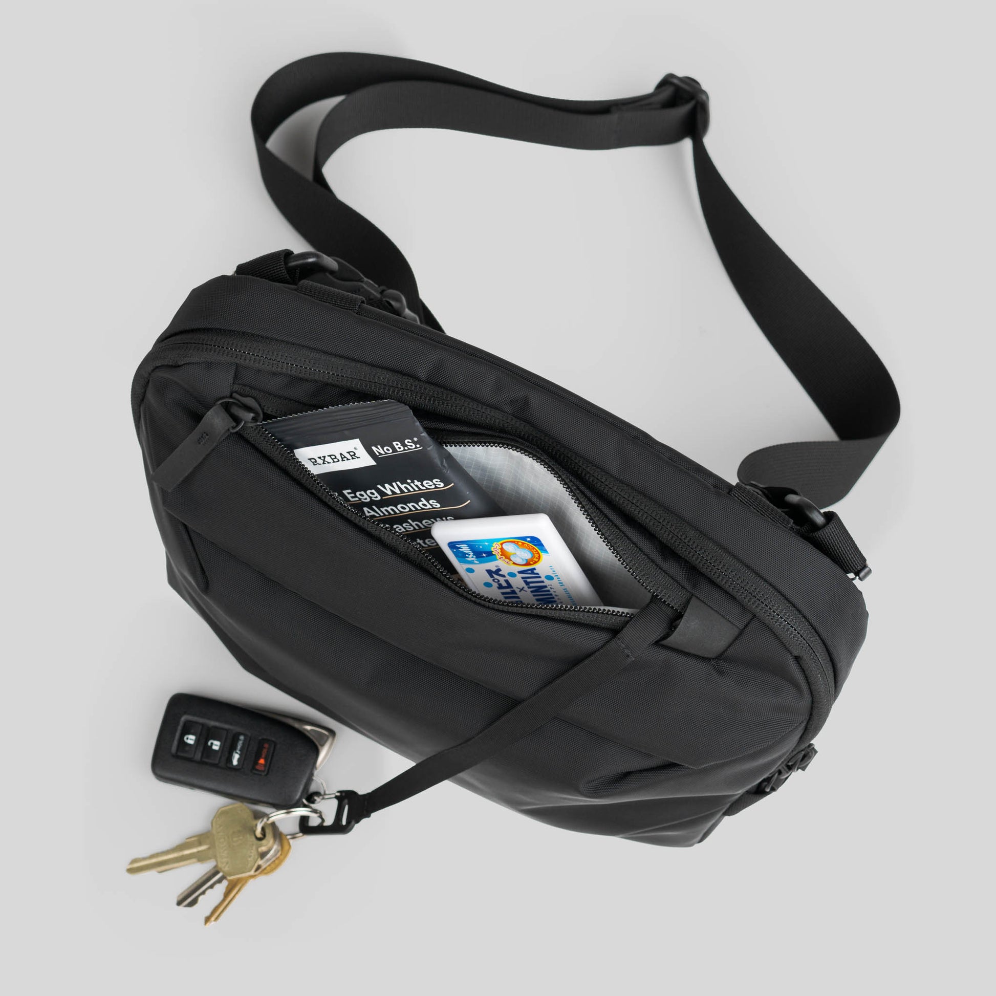 Toshi Sling 5L top quick access pocket