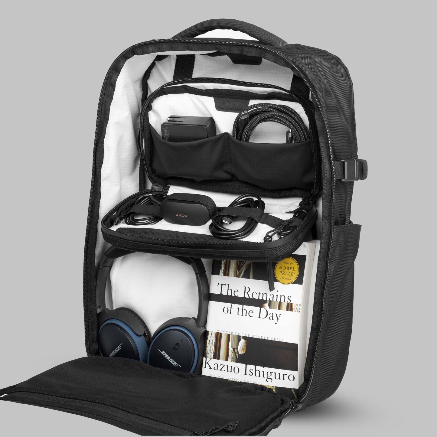 22L Reset Pack by Rework Gear sitting upright with the main compartment open and the Tech Case attached to the interior.