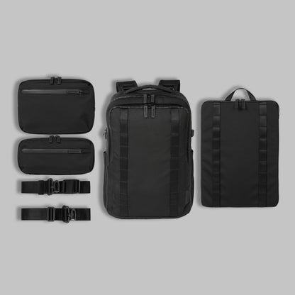 Modular components of Rework Gear's modular backpack organized in a flat lay against a gray background.