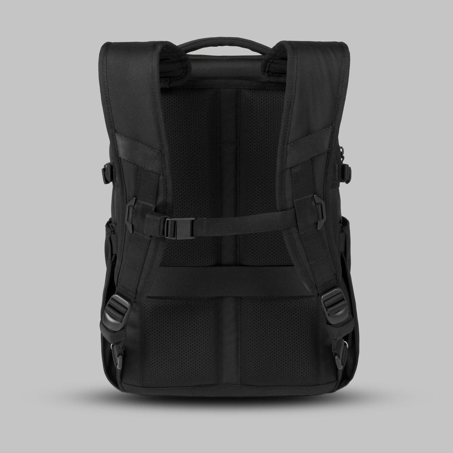 Back view of the 22L Reset Pack by Rework Gear against a gray background.