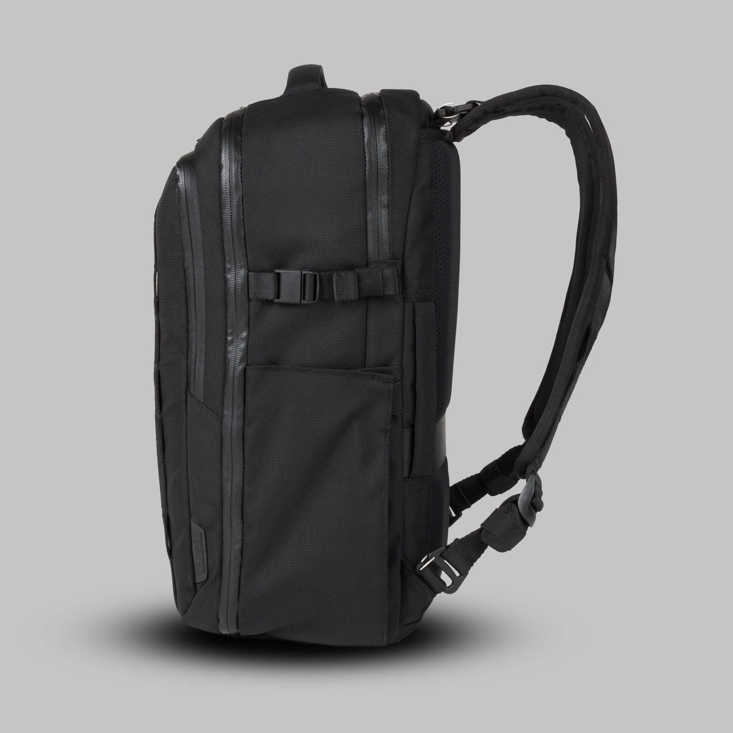 Side view of the 22L Reset Pack by Rework Gear against a gray background.